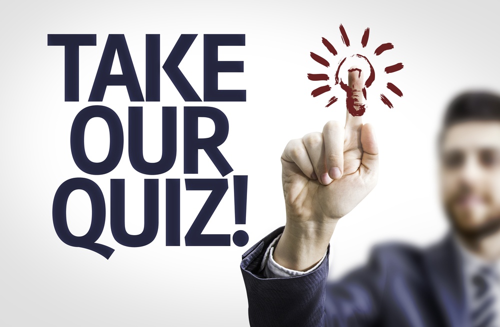 Business man pointing to transparent board with text Take Our Quiz.jpeg